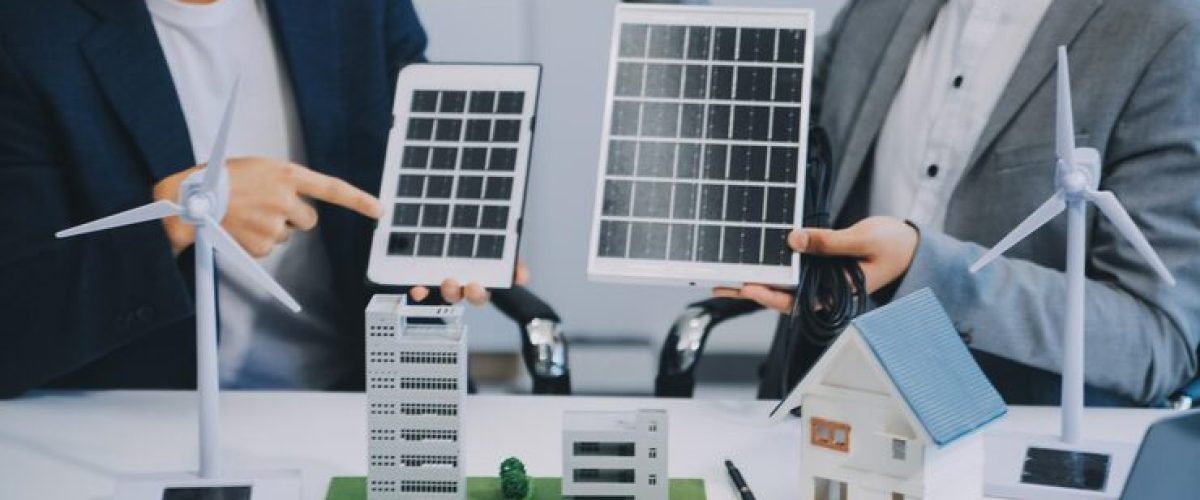 two-young-engineers-expertise-solar-cell-installation-meetings-discussion-job-planning-install-solar-photovoltaic-panels-roof-top-office-room-with-factory-building-plan_265022-79649